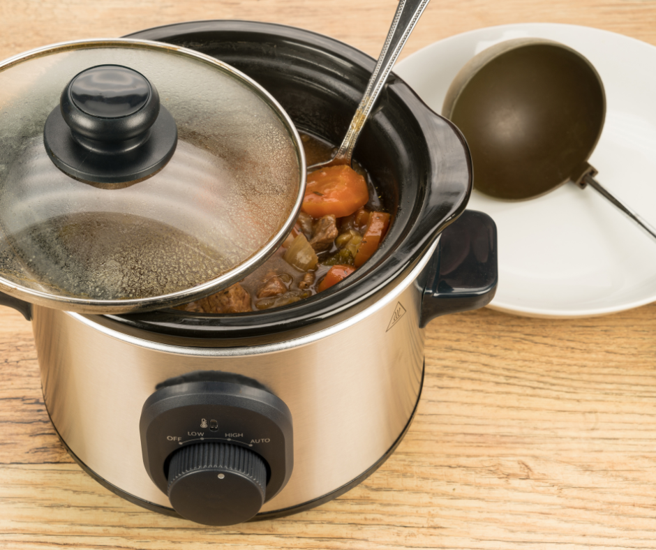 crock pot on counter with spoon and lid